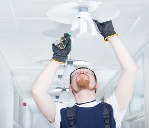 20153979 - man fixing lamp